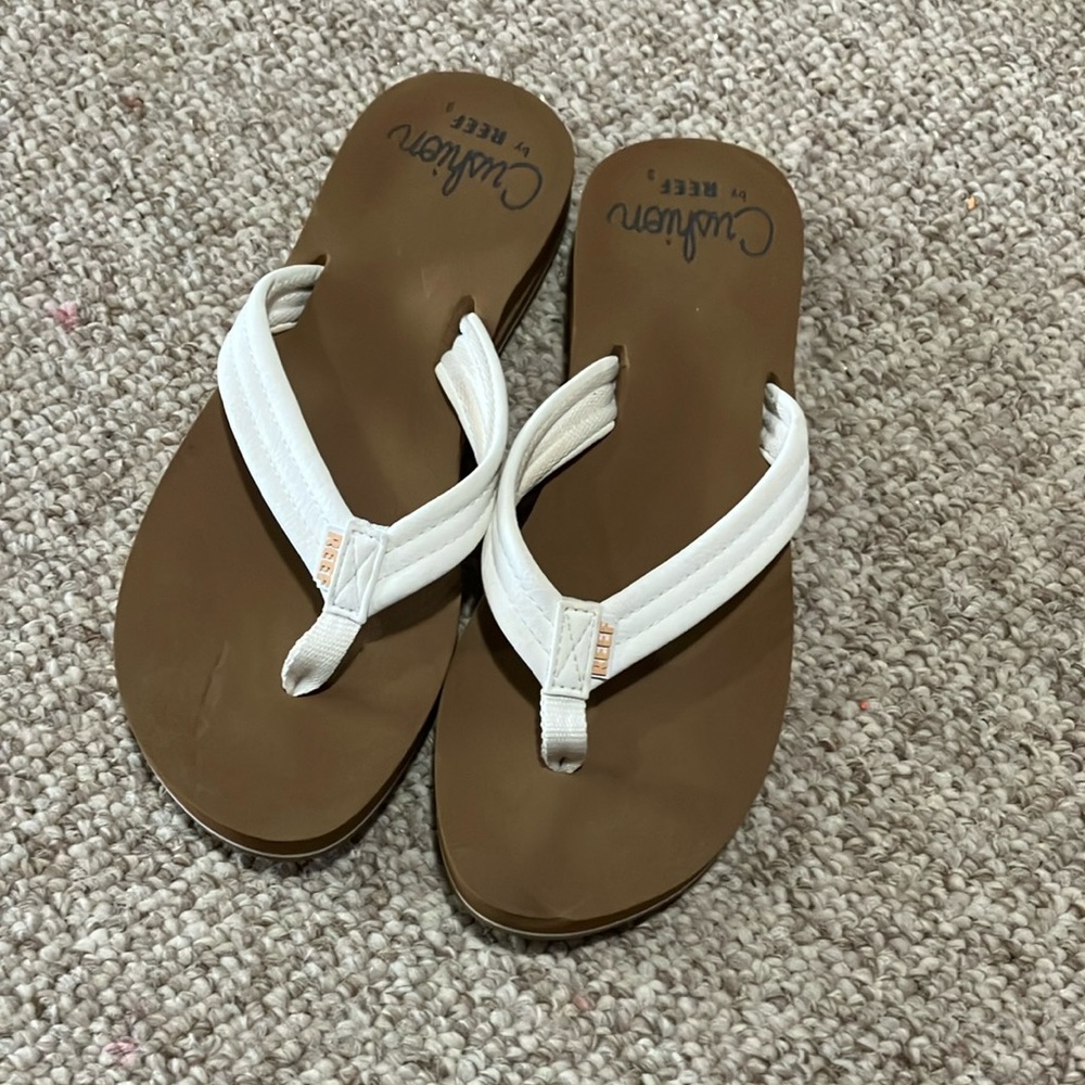 White and Brown Flip Flops